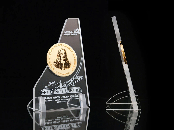 Corporate medal on an acrylic stand